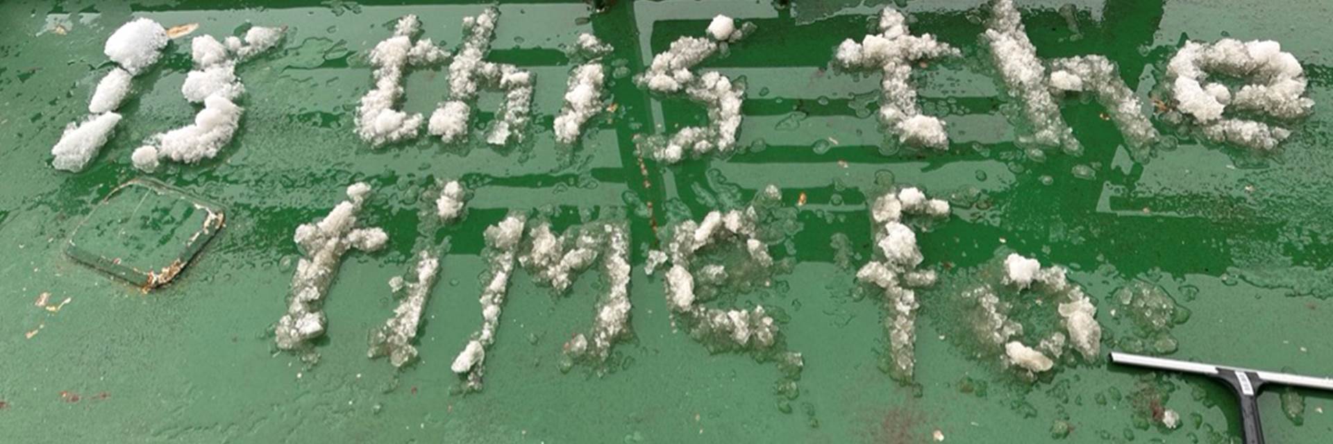 På grönt underlag står det skrivet med snö: Is this the time fo... 